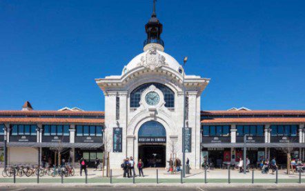 Historic train station building under a clear blue sky.